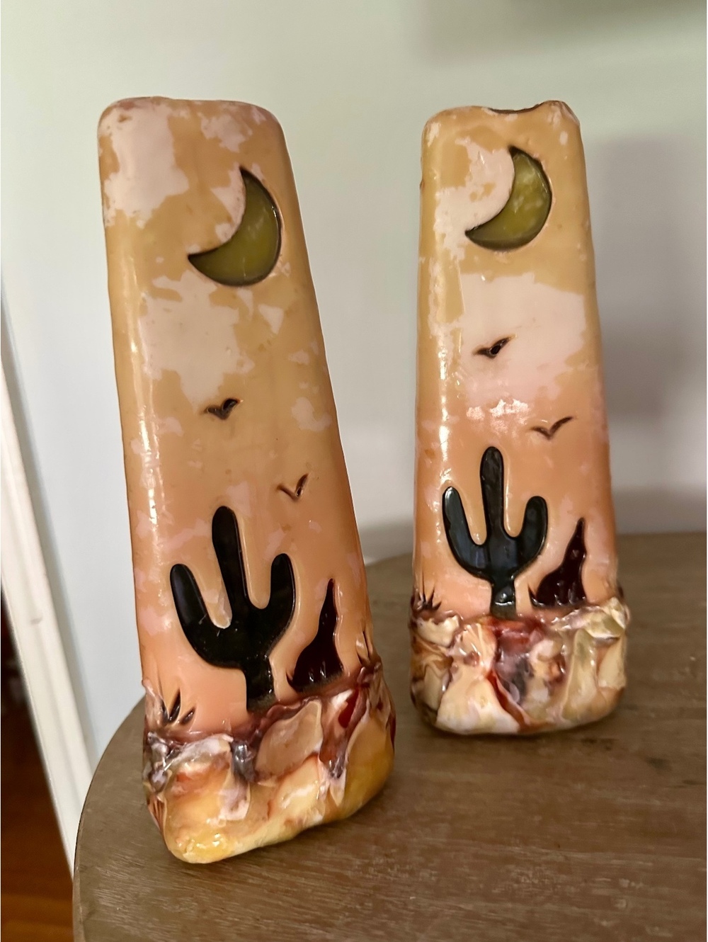 Vintage southwest hand carved candle pillars glow through cactus moon wold bird